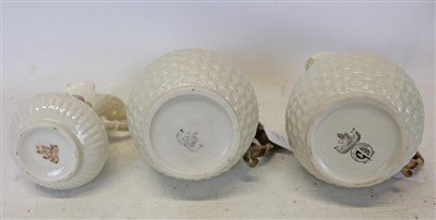 Lot 2001 - Group of six Belleek porcelain jugs