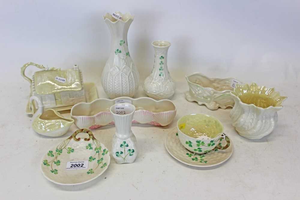 Lot 2002 - Group of ten pieces of Belleek porcelain to include cup and saucer, swan, butter dish cottage and vases etc