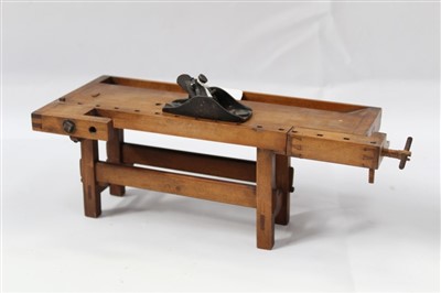 Lot 3763 - Early 20th century miniature model of a work bench together with an antique miniature plane