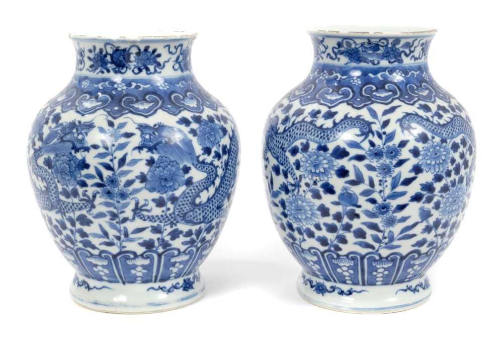 Lot 62 - Pair of 19th century Chinese blue and white porcelain dragon vases