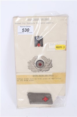 Lot 530 - Nazi Red Cross badges and insignia Mounted on board