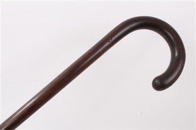 Lot 635 - Unusual Irish carved bog oak walking stick, 19th century patridgwood cane and another cane