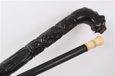 Lot 631 - Early 19th century ebony walking stick and Anglo-Indian carved ebony walking stick