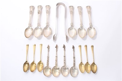 Lot 281 - Set of six George IV Kings pattern teaspoons, six silver gilt spoons, four apostle spoons, sugar tongs