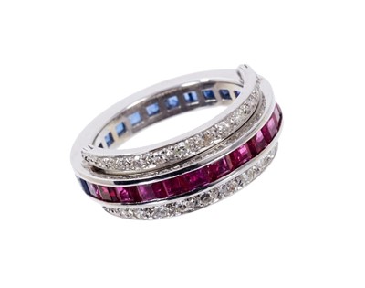 Lot 401 - Diamond, sapphire and ruby eternity ring