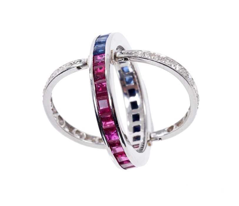 Lot 401 - Diamond, sapphire and ruby eternity ring