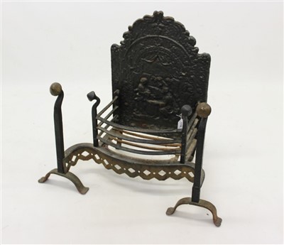 Lot 1338 - Antique fire back with shaped brass front to grate