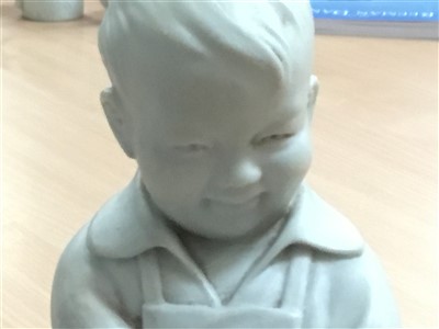 Lot 50 - Chinese Communist blanc-de-chine figure of a boy