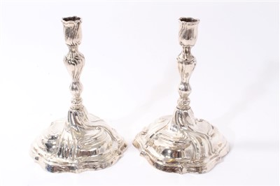 Lot 325 - Pair 17th century rococo-style silver candlesticks