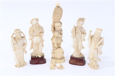 Lot 672 - Chinese carved ivory figure of boy holding a barrel on his head and four other figures