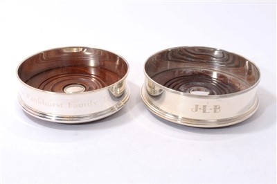 Lot 338 - A contemporary silver wine coaster of circular form, Mappin & Webb and another similar