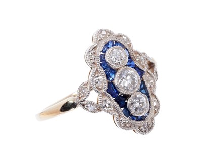 Lot 416 - Sapphire and diamond ring, oval lozenge shape plaque with three old brilliant cut diamonds