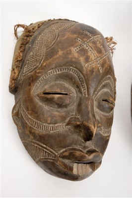 Lot 717 - Antique carved Chokwe tribe mask and two further tribal masks