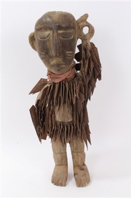 Lot 718 - Antique Nkisi power figure, standing, embedded with steel blades, 51cm high