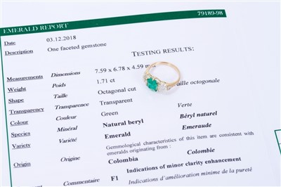 Lot 471 - Emerald and diamond three stone ring, emerald 1.71cts, estimated total diamond weight 1.70cts