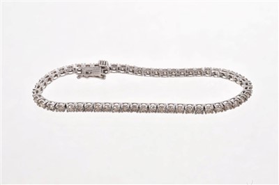 Lot 490 - Diamond tennis bracelet with a line of 55 brilliant cut diamonds in 18ct white gold setting