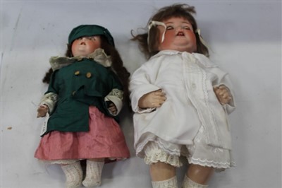 Lot 2710 - Dolls bisque head marked Heubach Koppelsdorf 320.0 , fixed blue eyes, open mouth top two teeth showing, painted lashes brows and lips, composite bent limb and body. plus one similar no. 342.6