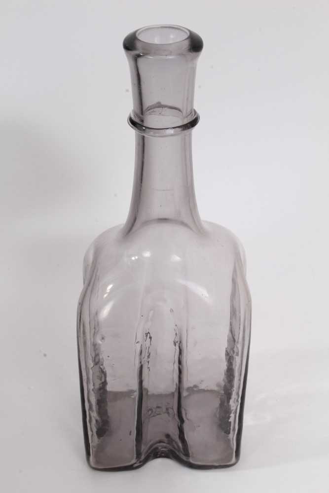 Lot 87 - Antique grey glass bottle with string collar