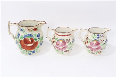Lot 134 - Three graduated 19th century pottery jugs