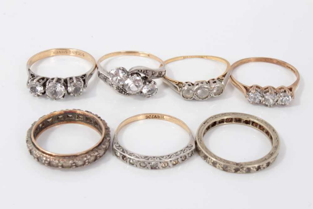 Lot 3300 - Seven gold and silver dress rings with synthetic white stones