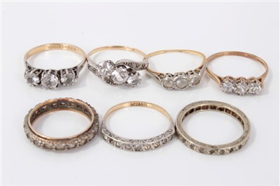 Lot 3300 - Seven gold and silver dress rings with synthetic white stones