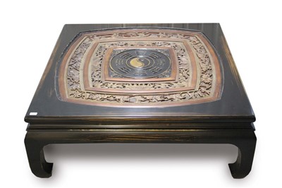 Lot 1405 - Large Chinese low table with relief carved inset pierced concentric panel on ebonised scroll legs 130cm square