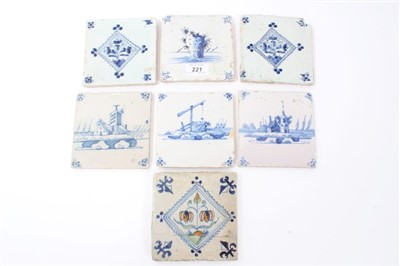 Lot 830 - Seven 18th century Delft blue and white tiles with painted building decoration