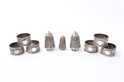 Lot 369 - Set six Eastern white metal napkin rings, pair silver salt and pepper casters, similar caster