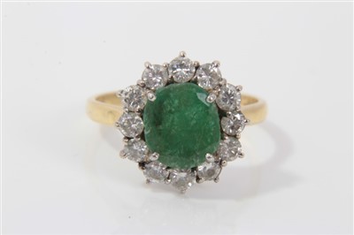 Lot 3231 - Gold (18ct) emerald and diamond cluster ring with an oval emerald surrounded by twelve brilliant cut diamonds in claw setting, ring size P