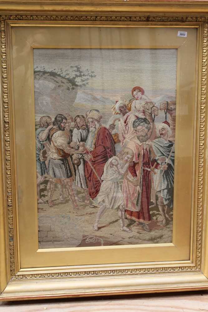 Lot 3053 - Three large hand embroidered wool tapestries illustrating biblical stories. Framed and glazed.