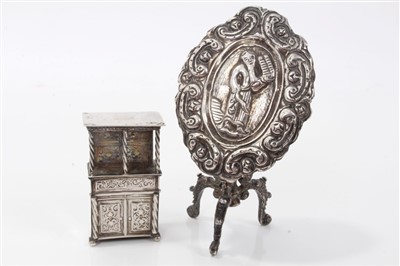 Lot 2719 - Unusual 19th century Belgian miniature silver tilt-top occasional table, the oval top embossed with figure of Moses, on tripod base , 6cm high, together with a 19th century Belgian silver model of...