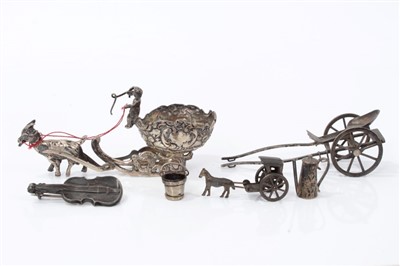 Lot 2730 - Antique Continental miniature model of a sleigh, 8cm long, together with model of a rickshaw, silver violin brooch and other silver and white metal miniatures