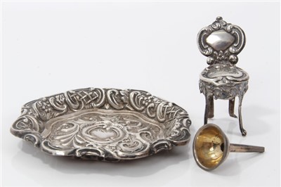 Lot 2731 - Victorian miniature silver salver, embossed shaped circular form, Birmingham 1876, 7cm diameter, together with a Victorian miniature silver wine funnel and miniature silver chair