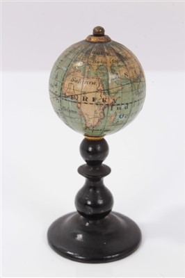 Lot 2736 - Very rare late 19th / early 20th century miniature table globe, revolving on ebonised stand, 6cm high