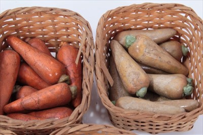 Lot 3775 - Collection of antique miniature painted ceramic vegetables, carrots, cauliflowers etc, presented in woven baskets