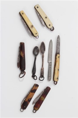 Lot 2739 - Collection of miniature penknives, each with folding blade, in bone or tortoiseshell, 2cm and smaller, together with miniature cutlery