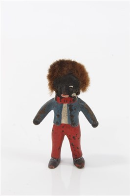 Lot 2743 - Two miniature cold painted bronze golliwog figures, the larger 3.5cm high, together with a cold painted metal; figure of a praying Arab