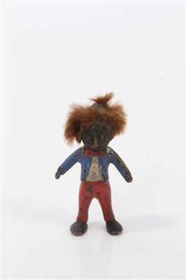 Lot 2743 - Two miniature cold painted bronze golliwog figures, the larger 3.5cm high, together with a cold painted metal; figure of a praying Arab