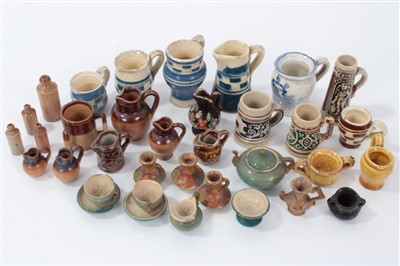 Lot 2755 - Collection of dolls house miniature stoneware and other rustic pottery