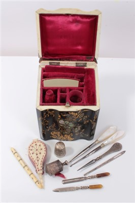 Lot 2765 - Mid 19th century papier mâché etui. In the form of a miniature knifebox, fitted with various sewing implements in gilt heightened serpentine case, 12cm