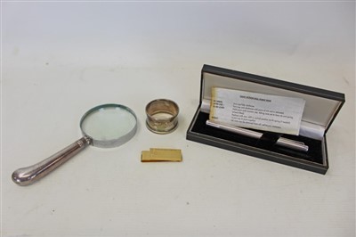 Lot 3622 - Silver handled magnifying glass, together with a silver fountain pen, a silver napkin ring and a gold plated money clip