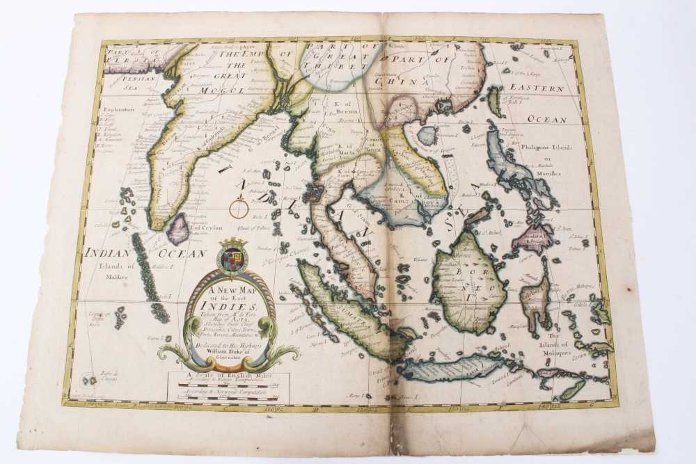 Lot 989 - Edward Wells (1667-1727), hand-coloured map - ‘A New Map of the East Indies’, 1700, 36cm x 50cm (severe staining).