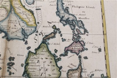 Lot 989 - Edward Wells (1667-1727), hand-coloured map - ‘A New Map of the East Indies’, 1700, 36cm x 50cm (severe staining).