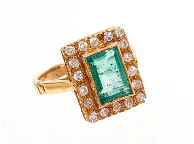 Lot 465 - 18ct gold emerald and diamond cluster ring.