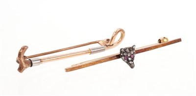 Lot 468 - Victorian diamond set fox’s head bar brooch and an Edwardian gold riding crop brooch (2).