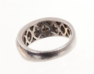 Lot 483 - Platinum and diamond ring with a wide band of baguette cut diamonds diamonds flanked by a border of brilliant cut diamonds in platinum setting