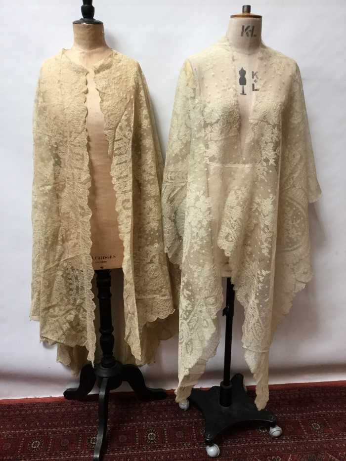 Lot 3066 - Antique and later lace including decorated net lace cape, similar table cloth, tambour lace square, needle decorated shawl.