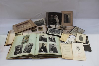 Lot 2434 - Postcard cards and photographs in two albums plus loose.