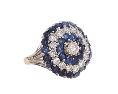 Lot 452 - Sapphire and diamond cluster ring