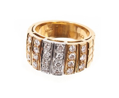 Lot 453 - White and yellow gold ring, the wide band with 22 brilliant cut diamonds